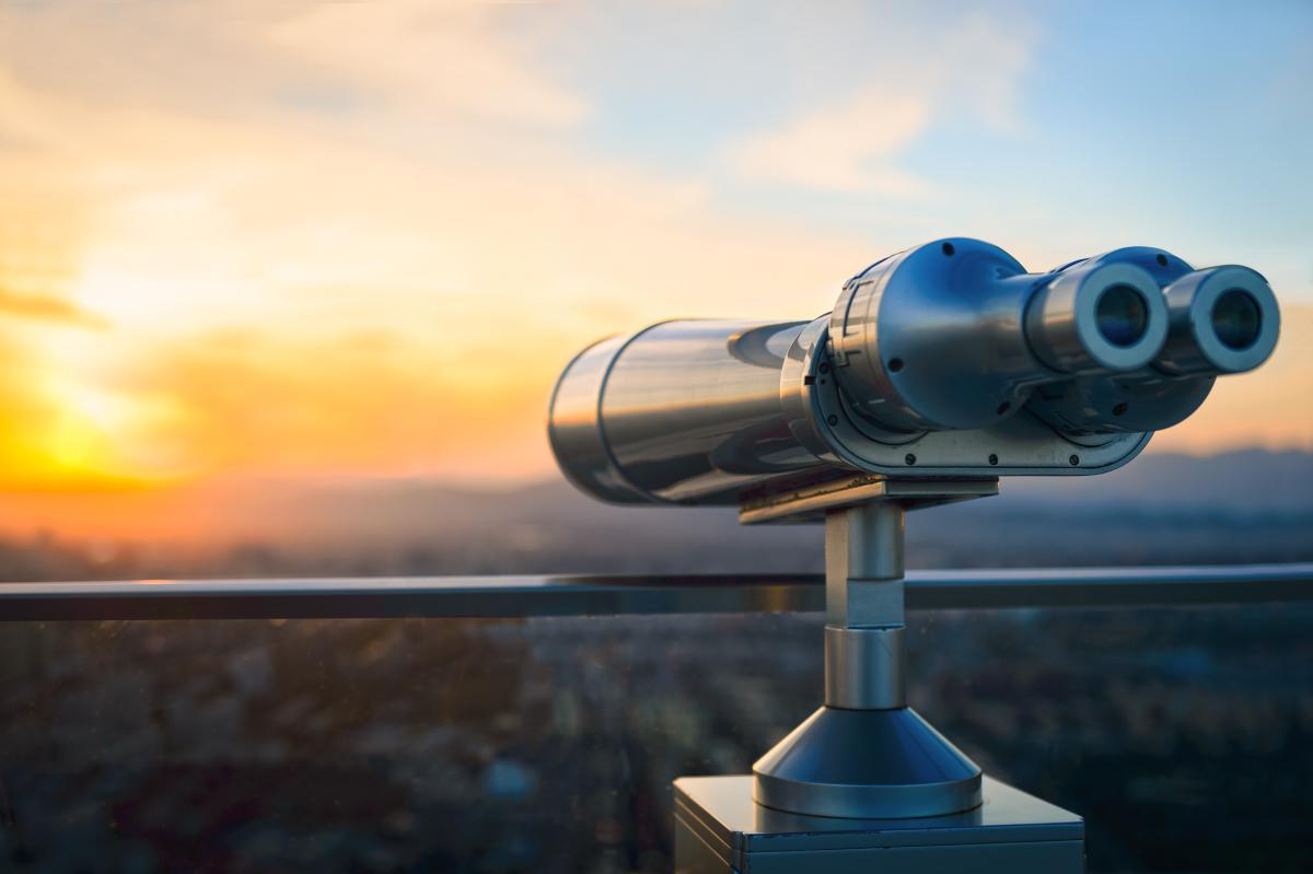 Conceptual iStock-500907542.jpg - binoculars looking out over a city