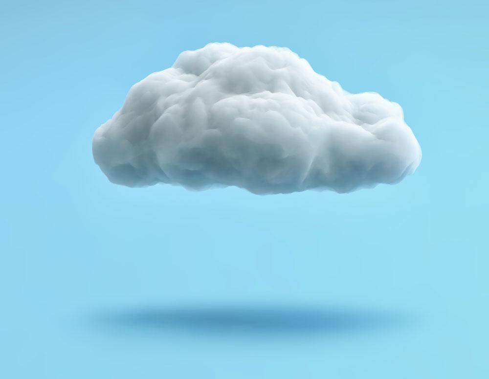 puffy cloud that appears to be made out of cotton hanging over light blue background