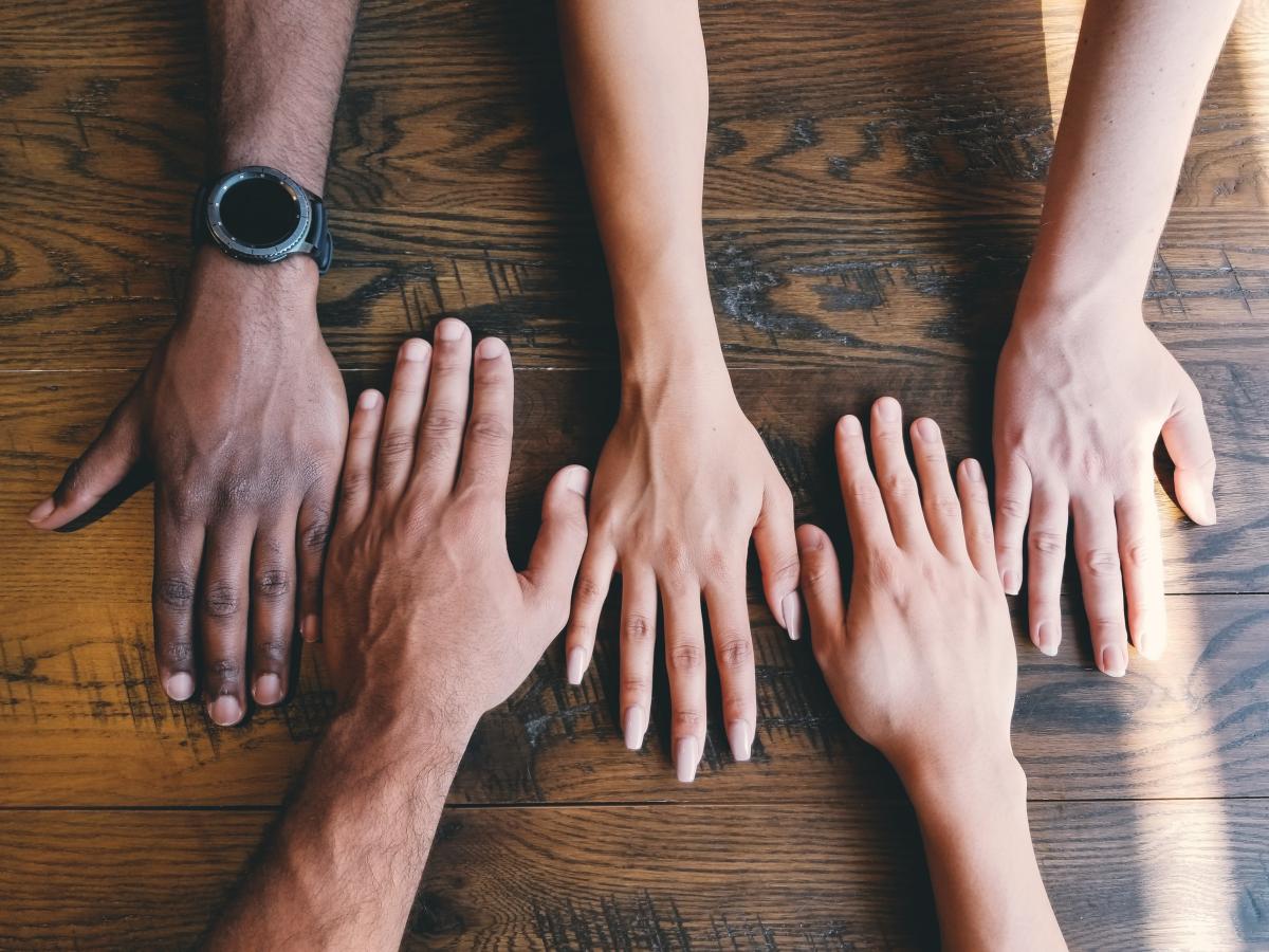 A variety of hands from people of different races