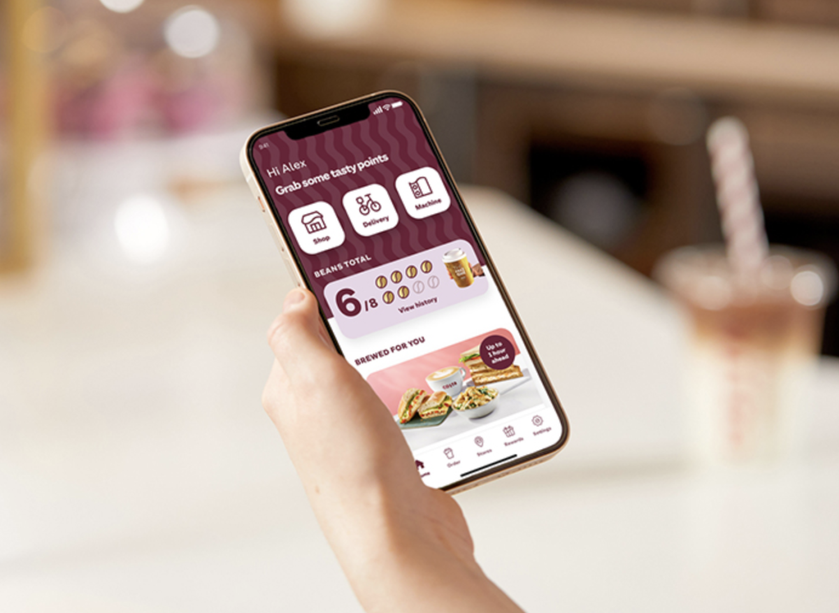 Costa Coffee mobile app held in the hand of a person