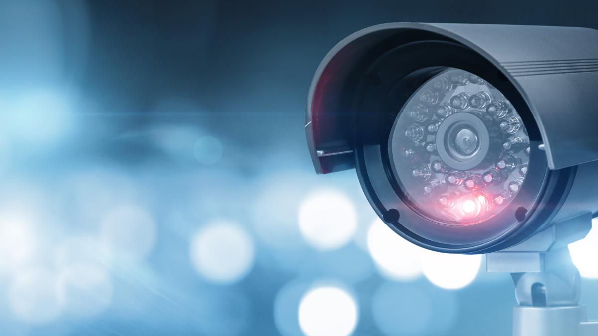 Close up of CCTV camera over defocused background with copy space. Analyze, visualize, insights, alerts, security,