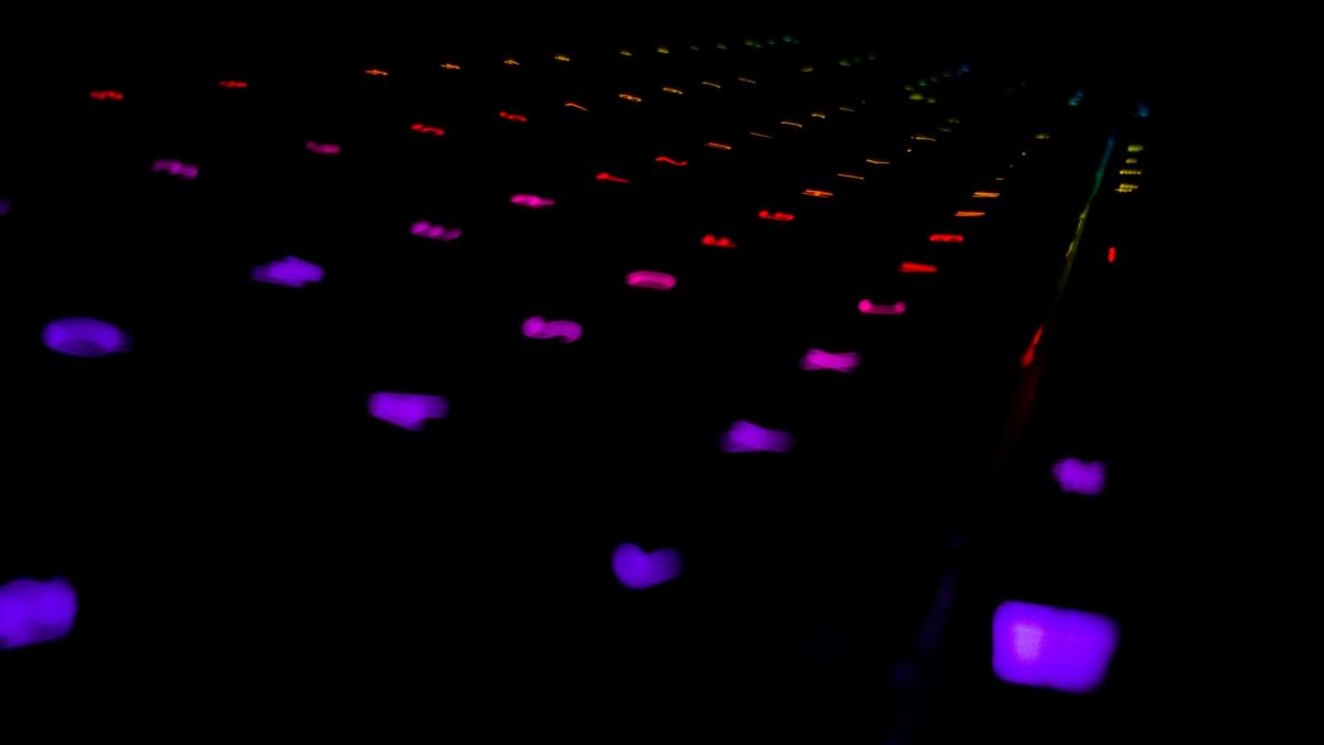 Devices - Black background with purple rectangle lights spread out in a grid