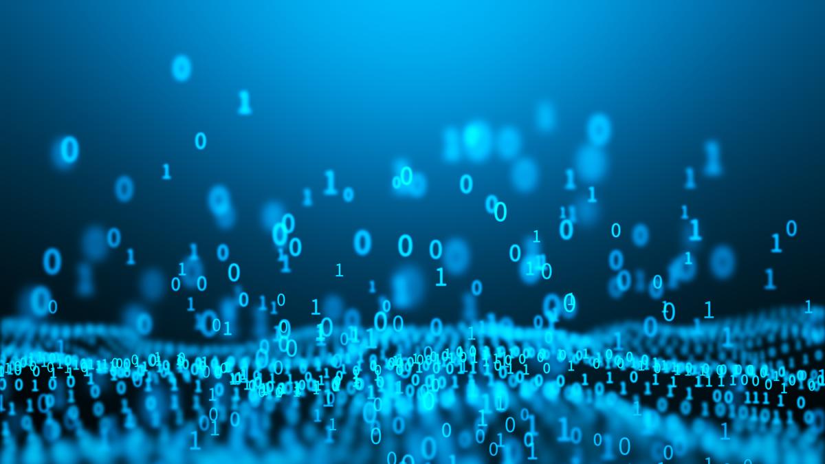 Conceptual iStock-1224968439.jpg light blue characters showing 1's and 0's with some of the numbers floating in the far distance