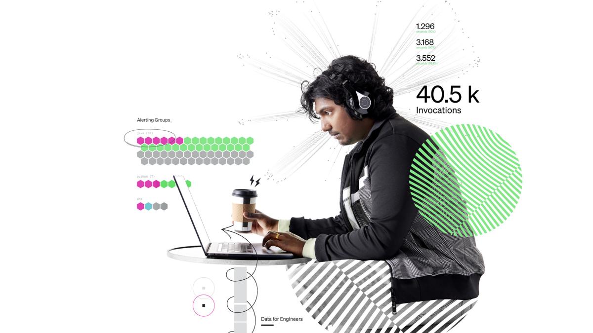 Engineer looking at computer while wearing headphones with a cup of coffee in hand
