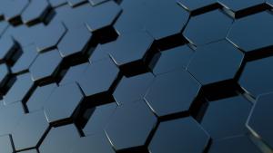 Image of stacked rows of black, shiny, 3-D hexagons