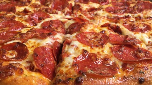 Close up of a pepperoni and cheese pizza 