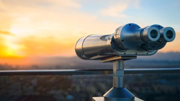 Conceptual iStock-500907542.jpg - binoculars looking out over a city