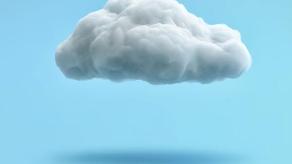 puffy cloud that appears to be made out of cotton hanging over light blue background