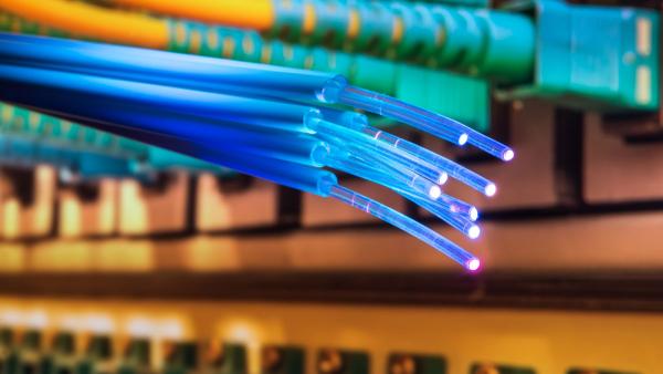 Fiber Optic cables and UTP Network cables connected hub ports.
