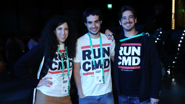 Three conference attendees smiling for a photo at FutureStack 22